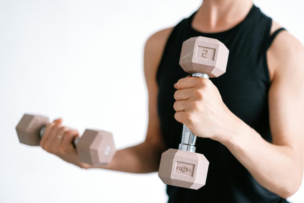 Person lifting dumbbells during a workout