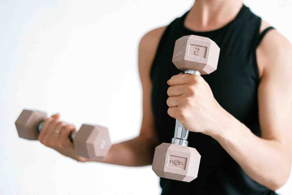 Person lifting dumbbells during a workout